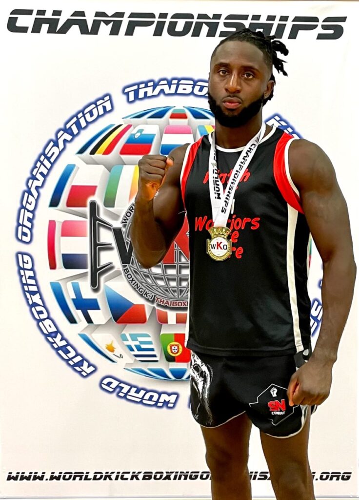 Samuel celebrates his win at the WKO World k-1 Open Championships