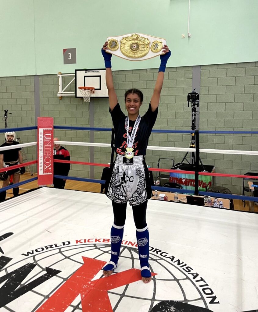 Yasmin holding her world title belt