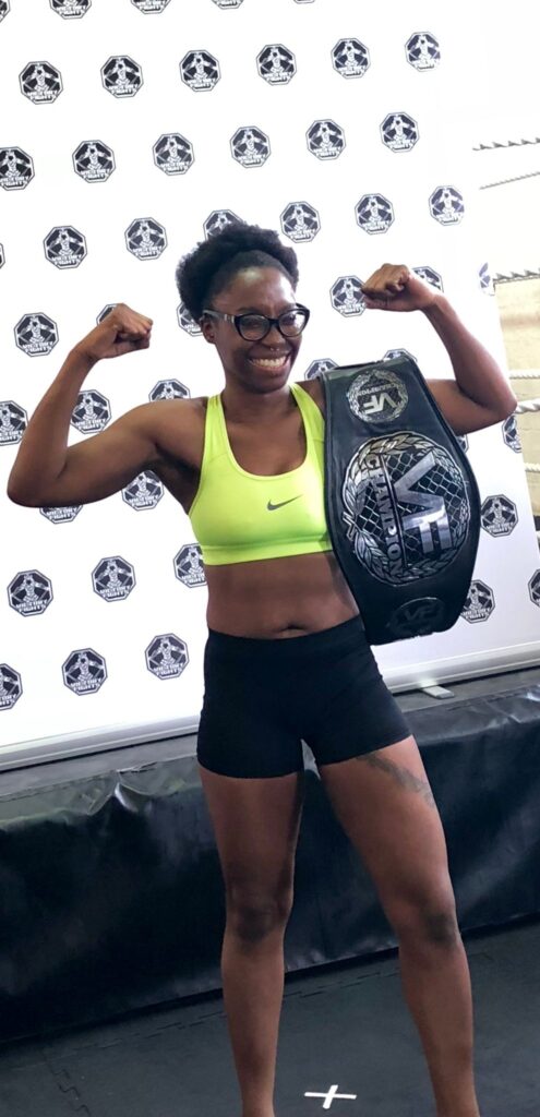 Elia Diane Dewu with title belt