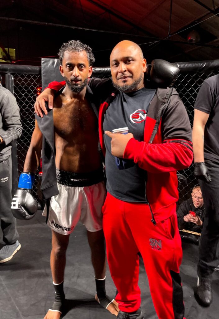 Siggy with his headcoach Khru Sam of SN Combat Academy