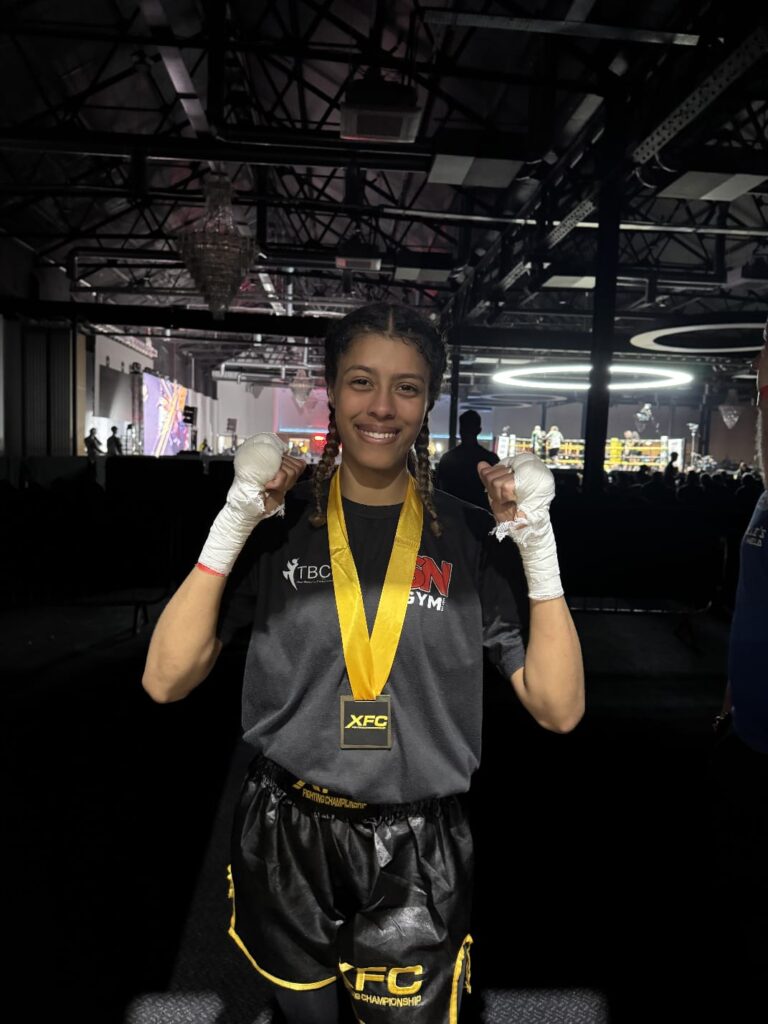 Yasmin Cleanheart Ahmed wearing her winners medal at the XFC Fighting Championships in Birmingham