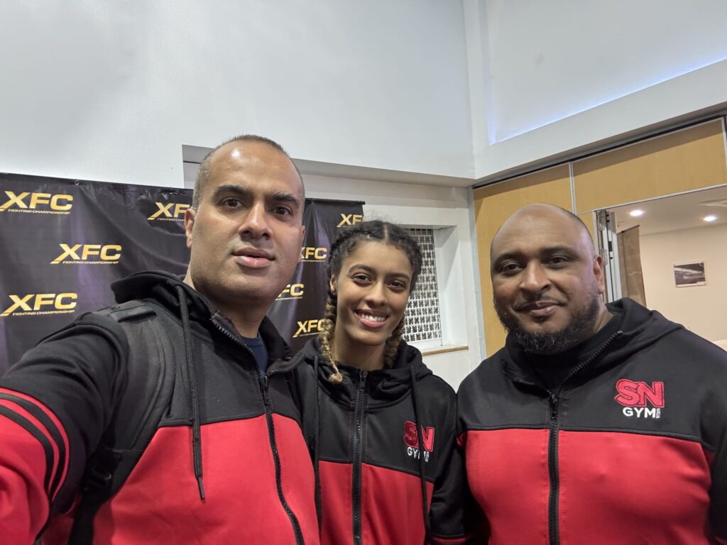 Yasmin "Cleanheart" Ahmed with SN Combat team and headcoach