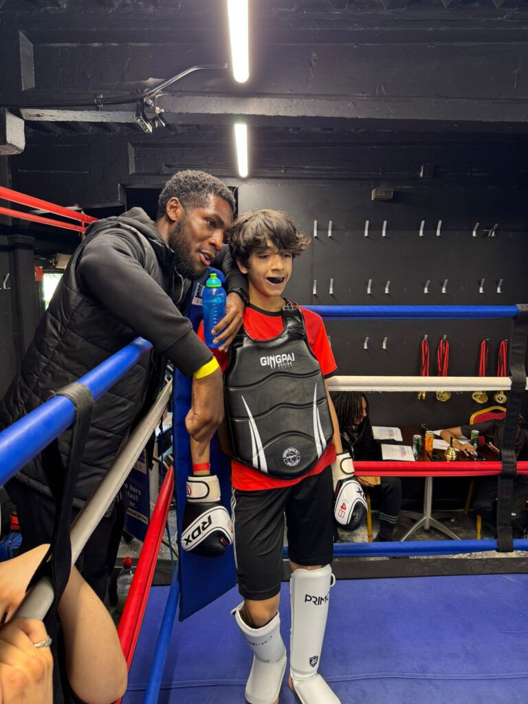 Junior fighter in ring corner