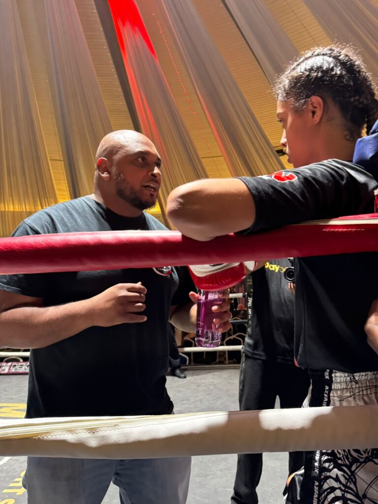 Yasmin in ring corner being instructed by her headcoach Khru sam Nankani