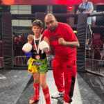 Ibrahim with headcoach Khru Sam Nankani at the Mortimier K-1 in the ring