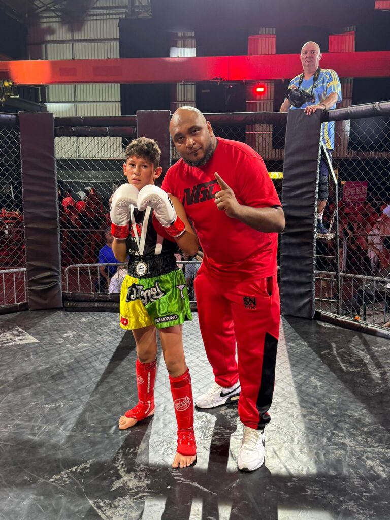 Ibrahim with headcoach Khru Sam Nankani at the Mortimier K-1 event