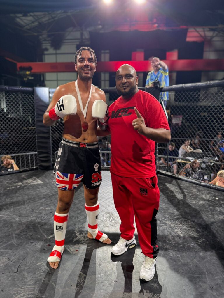 Koby Bright in the K1 ring after his impressive win, long side headcoach Khru Sam Nankani