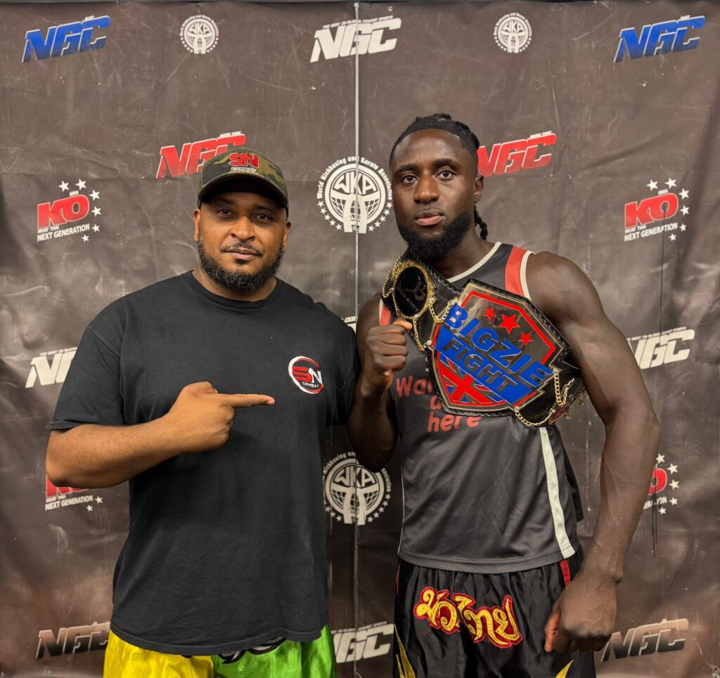 Samuel Osei with headcoach Khru Sam Nankani after his win