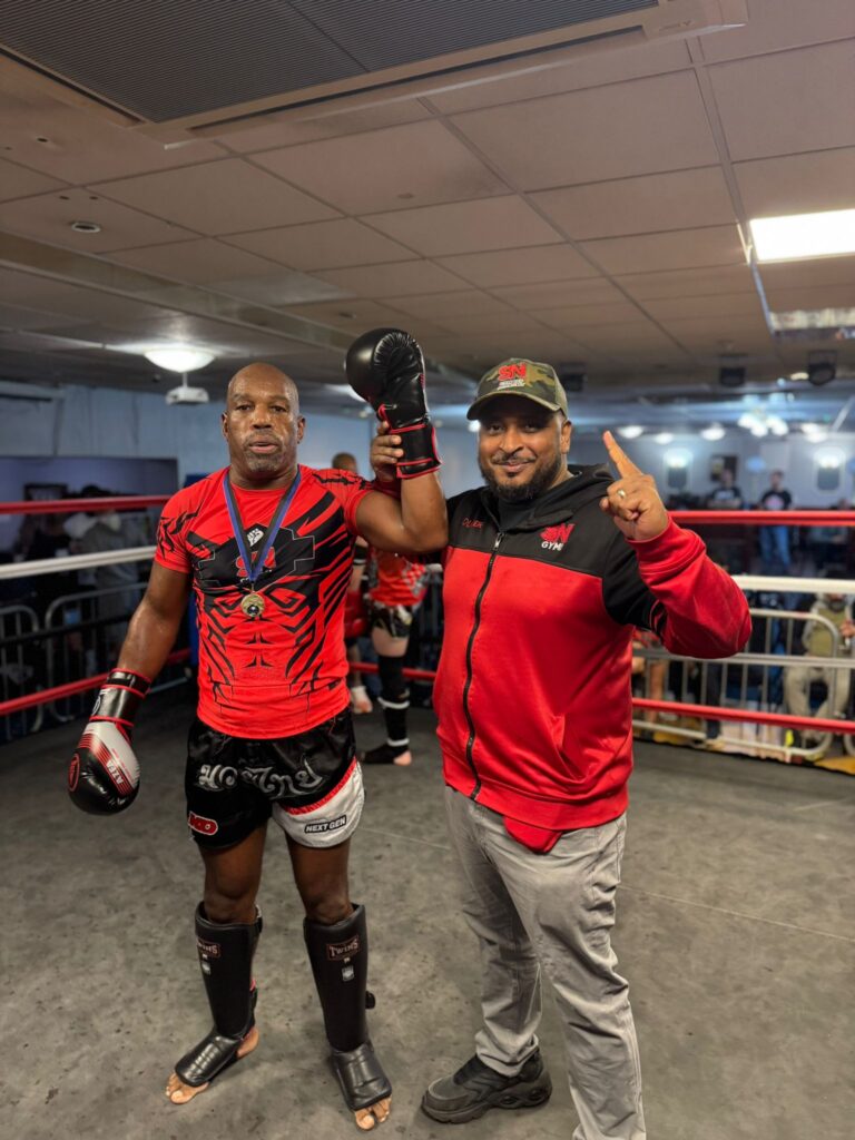 SN Combat fighter Derek age 64 with headcoach Khru Sam