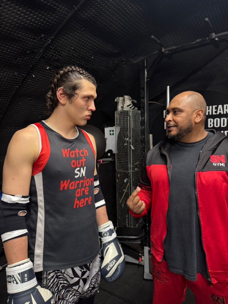 Shazhaib with headcoach Khru Sam in the ring