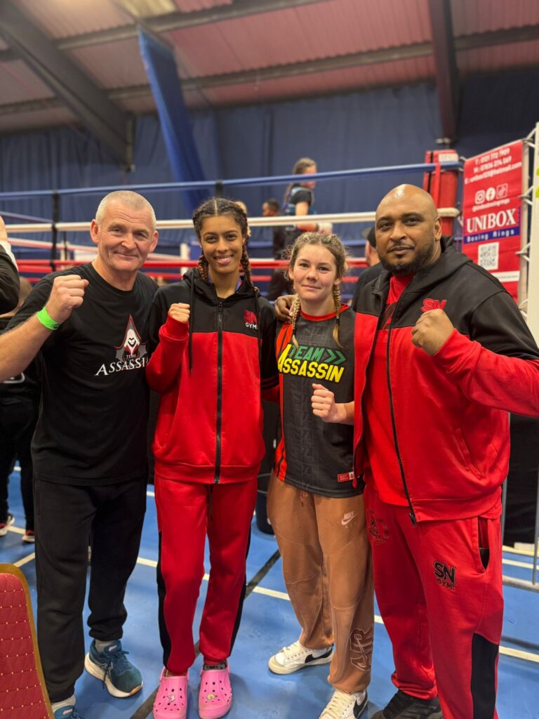 Yasmin Ahmed long side opponent and the head coaches from both gyms 