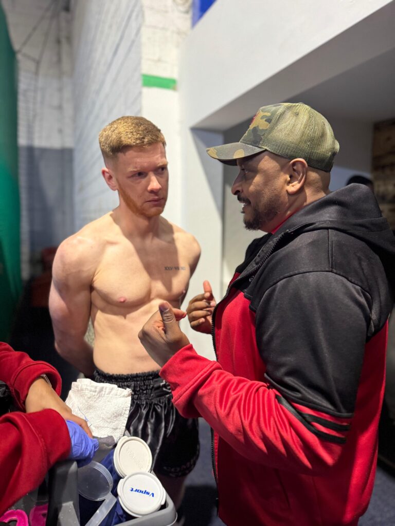 Danny Jackson speaking tactics with headcoach sam Nankani