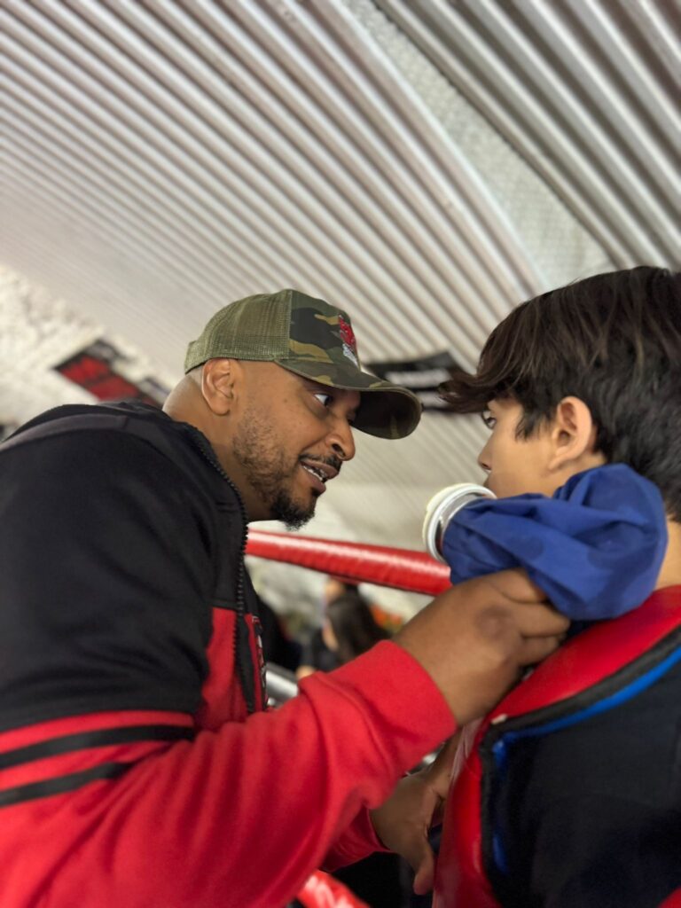 Aydin Quran in the ring corner taking instructions from headcoach Khru Sam Nankani K-1 debut